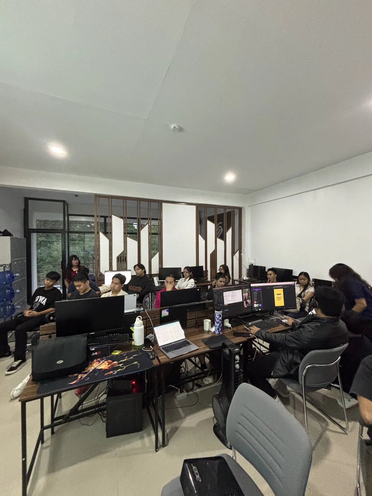 The team seated during a company assembly