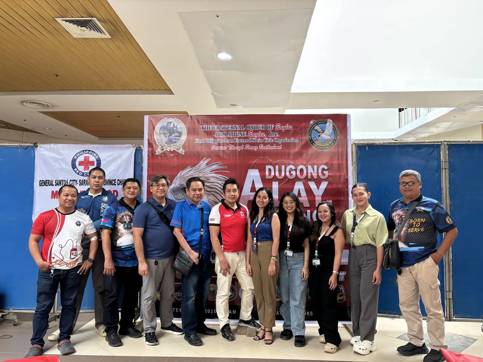 Seighton staff at the blood donation drive banner