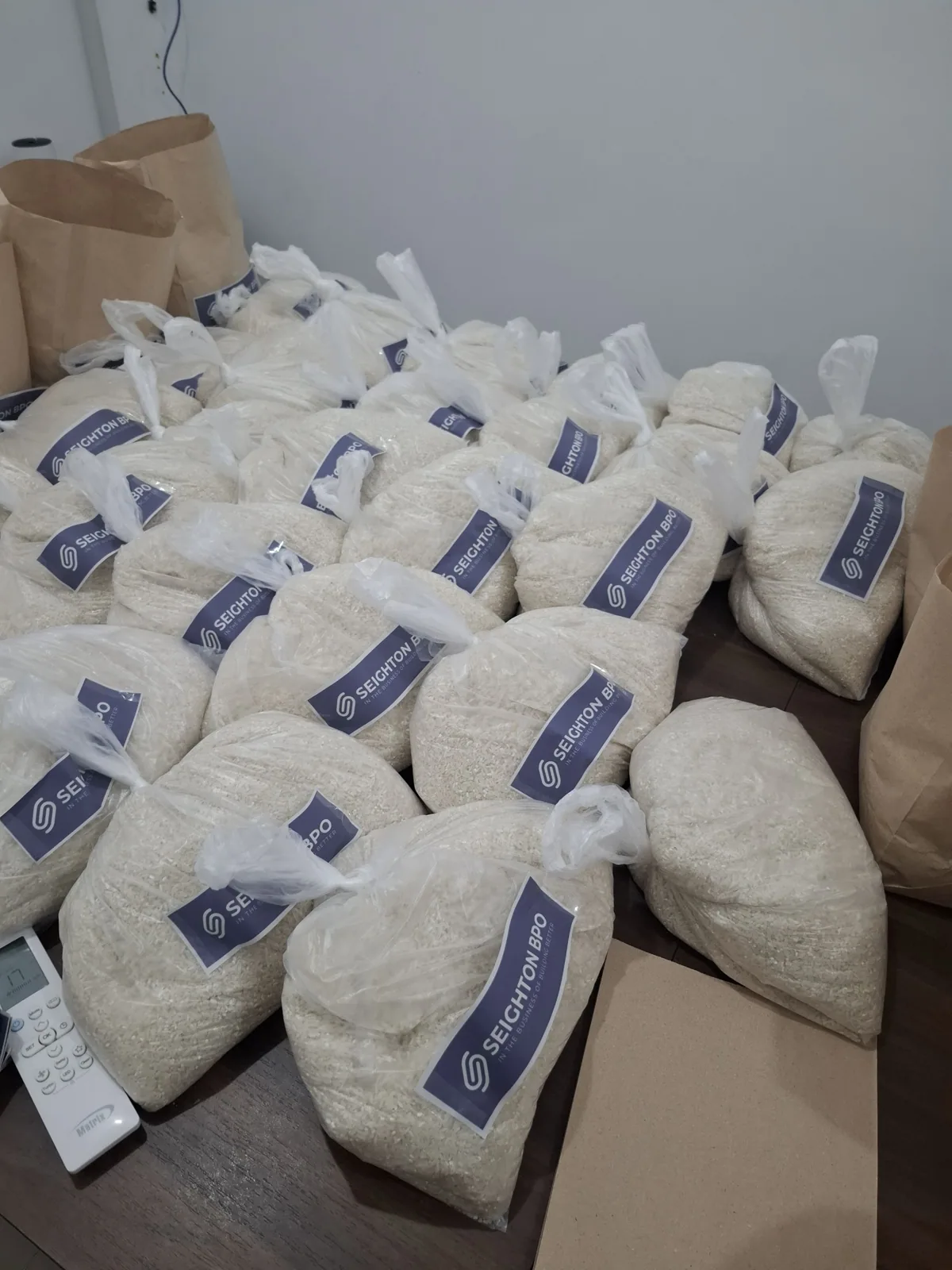 Sacks of rice packed in branded Seighton bags for the monthly rice allowance