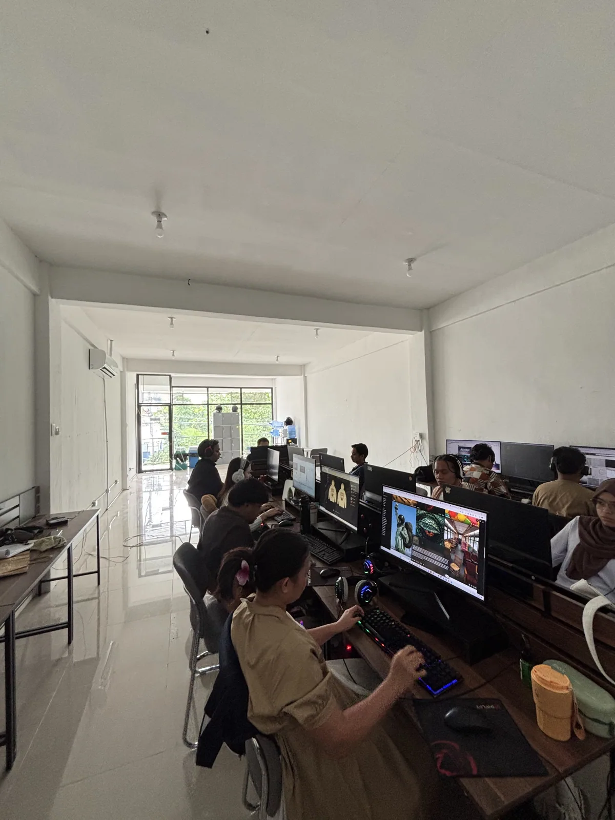 Rows of workstations in use during a shift